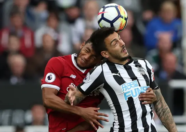 Liverpool's Gomez in action with Newcastle's Joselu