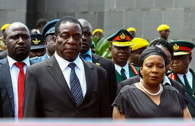 Emmerson Mnangagwa (L) and his wife Auxilia (R) attend the funeral ceremony of Peter Chanetsa at the National Heroes Acre in Harare, on 7 January 2017
