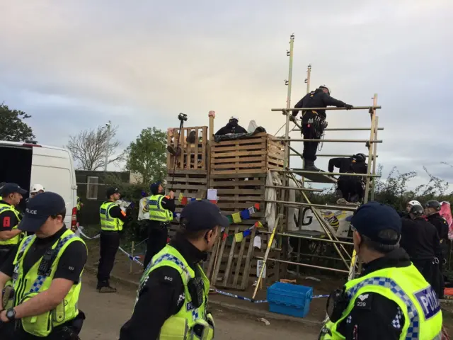 Protester on wooden tower