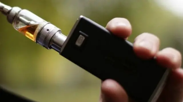 Person using cannabis oil