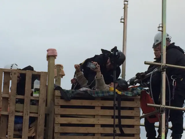 Protester on wooden tower