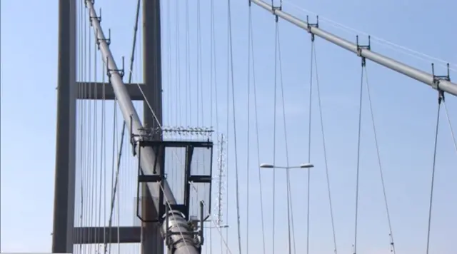 Humber Bridge showing one cable and the gate across it to stop access.