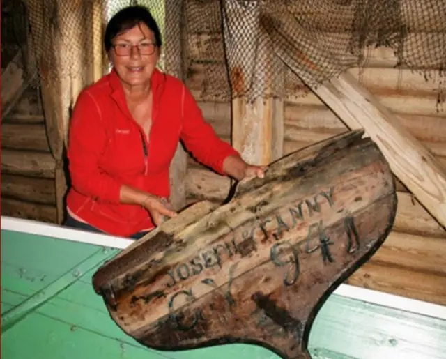 Kari Christensen with boat part