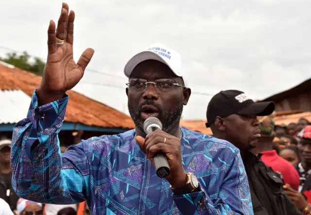 Former international Liberian football star turned politician George Weah, addresses supporters during a campaign rally in Monrovia on October 8, 2017, three days ahead of the country's elections