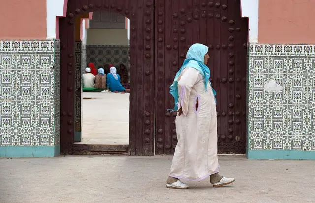 An anonymous woman walks down the street in Morocco