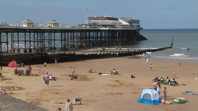 Cromer Pier, with beach visitors