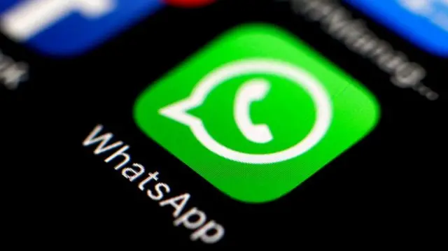 WhatsApp app logo seen on a phone