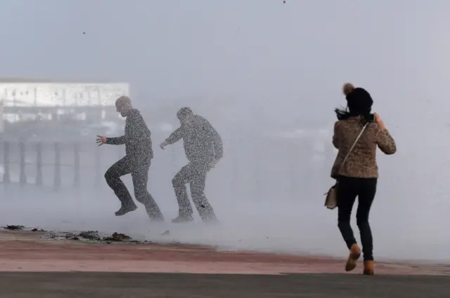 People get caught in the waves at Penzance, Cornwall