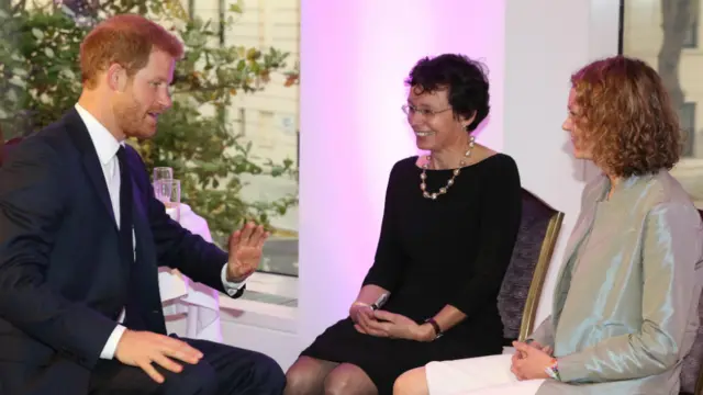 Prince Harry with Dr Lucy Grove and her daughter Charlotte