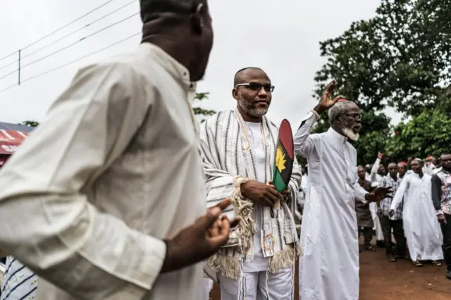 This file photo taken on May 27, 2017 shows political activist and leader of the Indigenous People of Biafra (IPOB) movement, Nnamdi Kanu (C) is joined by supporters and members of the Yahveh Yashua Synagogue (Yisraelities Biafra Region) during the celebration of Shabbat outside his residence in Umuahia