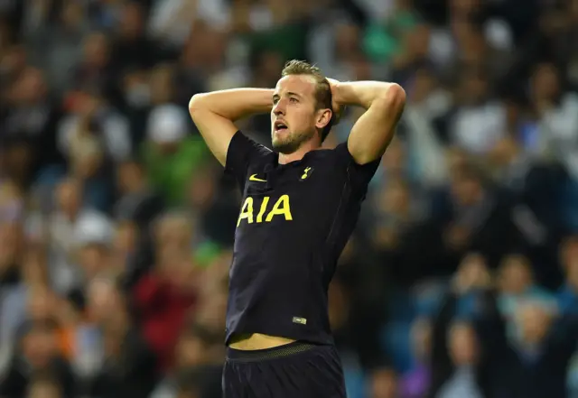 Harry Kane reacts to  a missed chance