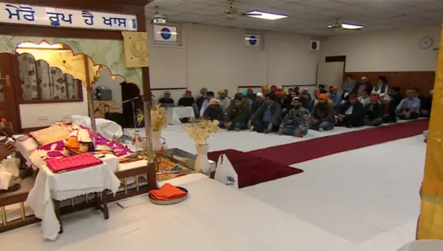 People inside a Gurdwara