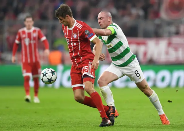 Celtic captain Scott Brown battles with Thomas Muller.