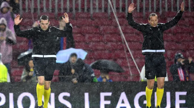 Officials warm up at the Nou Camp