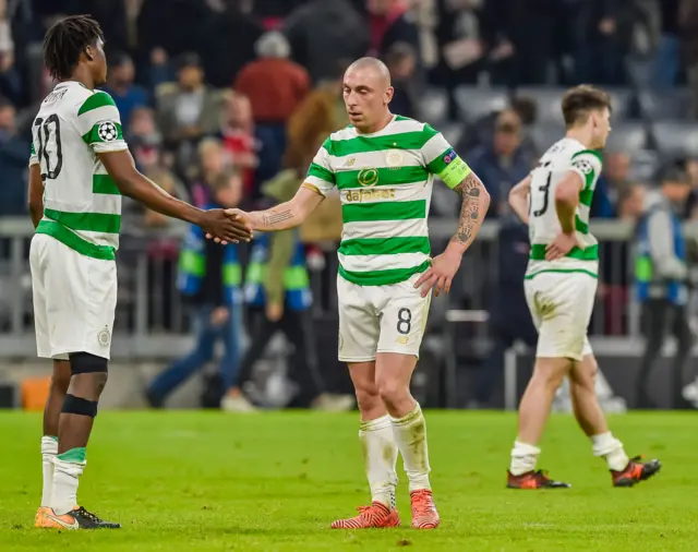 Dedryck Boyata and Celtic"s Scottish midfielder Scott Brown react