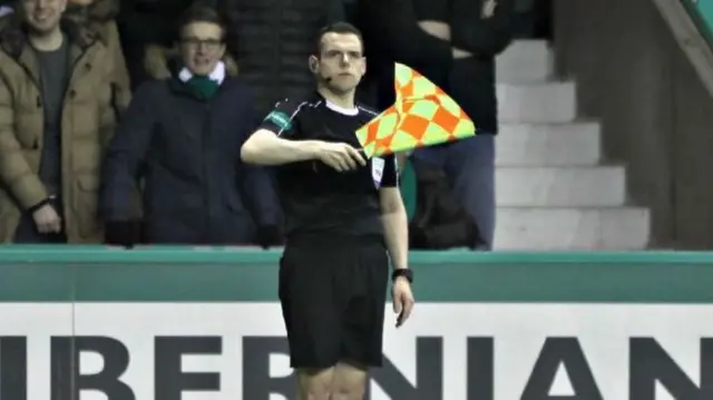 Tory MP Douglas Ross as an assistant referee