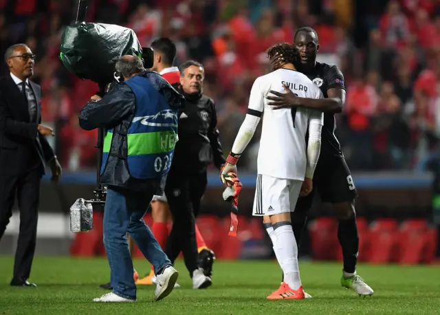 Benfica keeper Mile Svilar is consoled by Manchester United's Romelu Lukaku