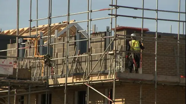 A house under construction on a building site