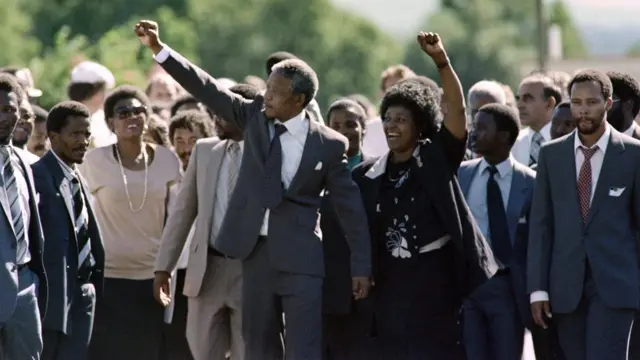 Former South African President Nelson Mandela (centre) with his wife Winnie following his release from Victor Verster prison on 11 February 1990