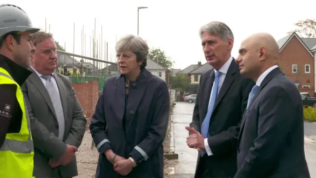 Philip Hammond, Theresa May and Sajid Javid