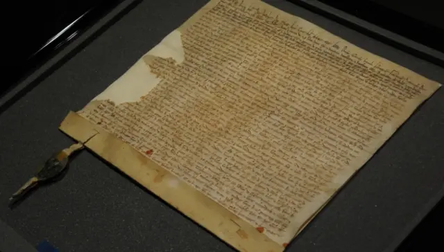 The 1217 charter inside a display case