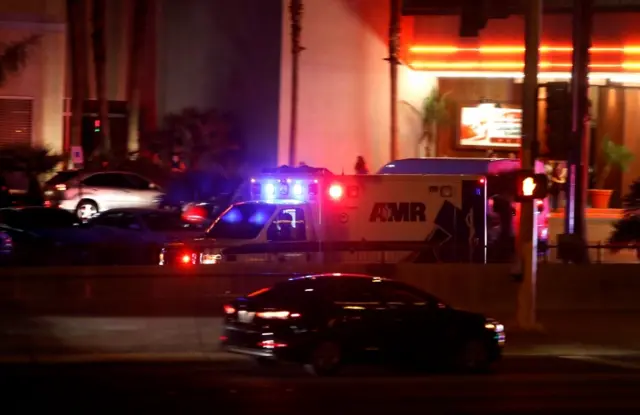 An ambulance heads to a hospital after the shooting