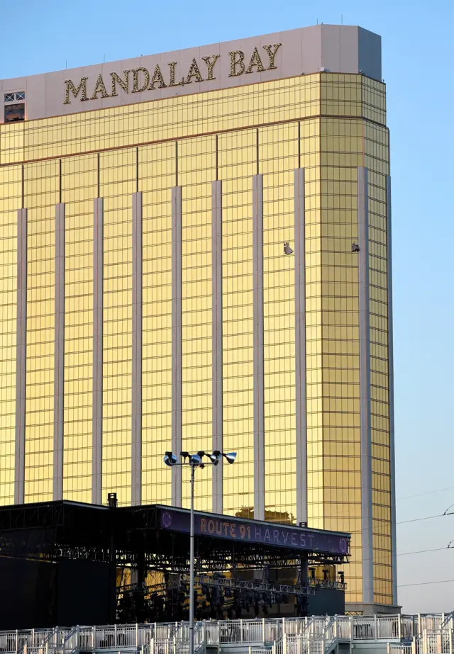 Image shows broken windows on the 32nd floor of the Mandalay Bay Resort and Casino