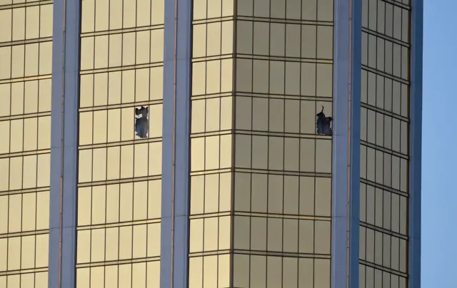 Image shows broken windows on the 32nd floor of the Mandalay Bay Resort and Casino