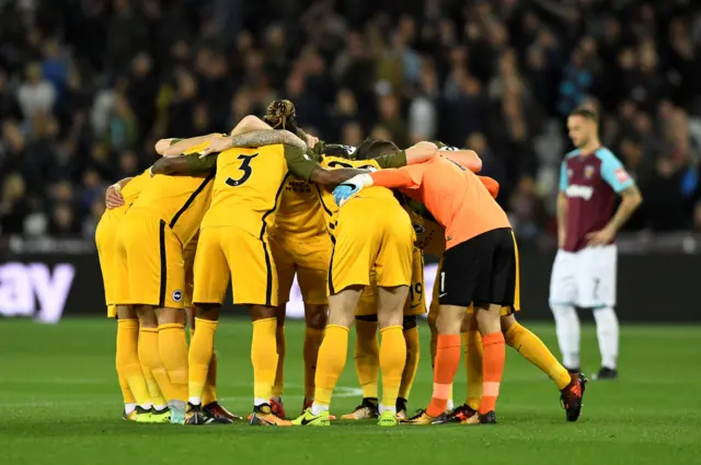 Brighton huddle before kick-off