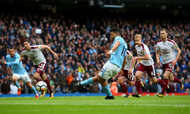 Sergio Aguero of Manchester City scores Manchester City's first goal