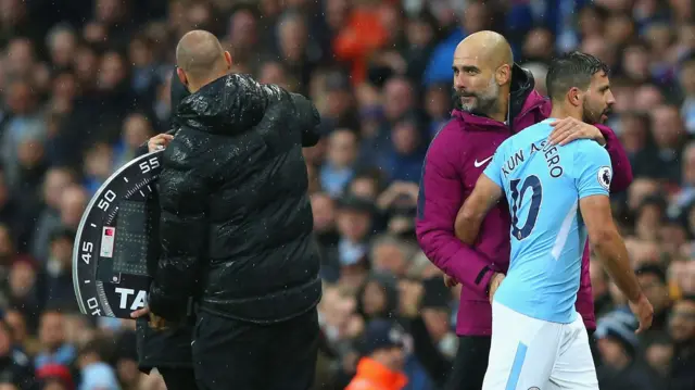 Sergio Aguero of Manchester City embraces Pep Guardiola