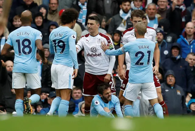 Matthew Lowton and Leroy Sane clash