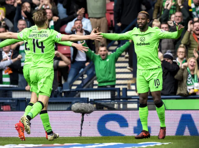 Celtic celebrate a goal from Moussa Dembele (right)