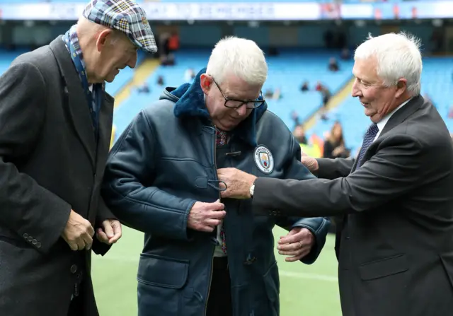 John Motson being presented with a Manchester City sheepskin coat