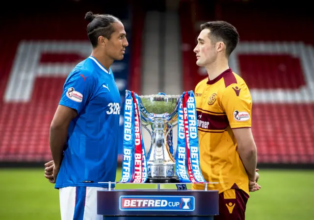 Rangers' Bruno Alves and Motherwell's Bob McHugh with the Scottish League Cup