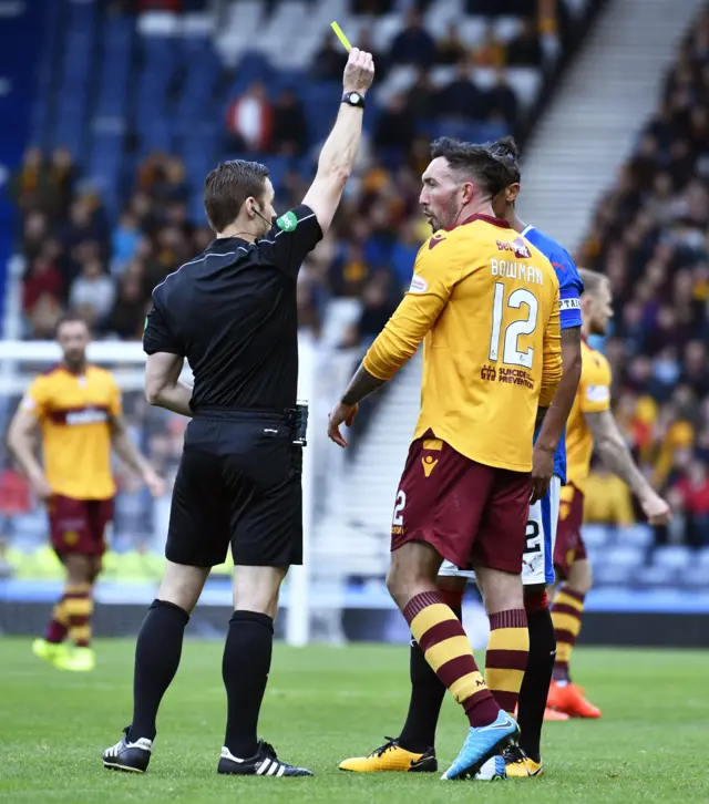 Motherwell's Ryan Bowman is shown the yellow card