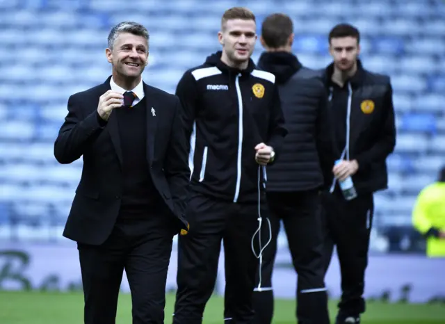 Motherwell manager Stephen Robinson enjoys the occasion with his players