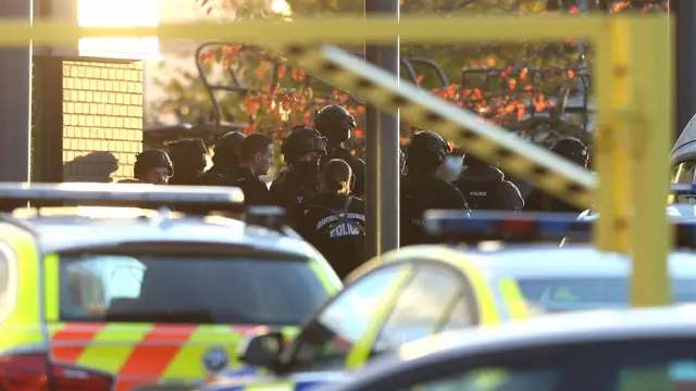 Police outside a bowling alley in Nuneaton on Sunday where two hostage were being held