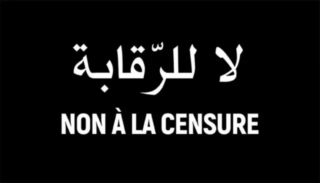 A sign reading 'no to censorship' in French and Arabic