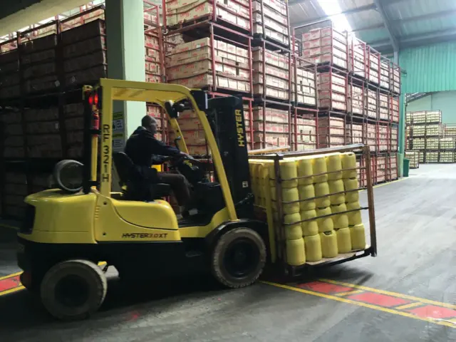 Bidco Africa worker in a Kenyan warehouse