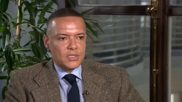 Clive Lewis MP, seated and wearing tweed jacket