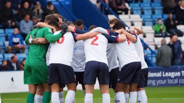 Players in huddle