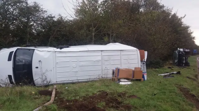 Van overturned by road