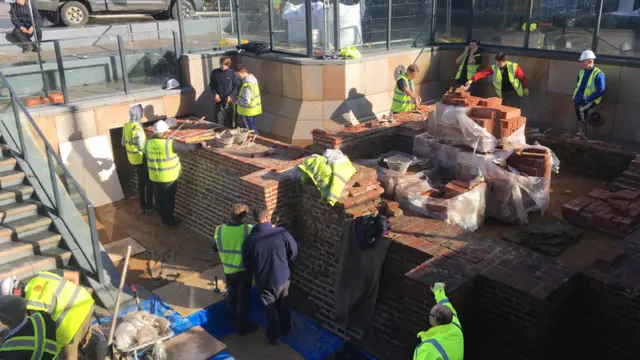 Workers in hard hats at Beverley Gate