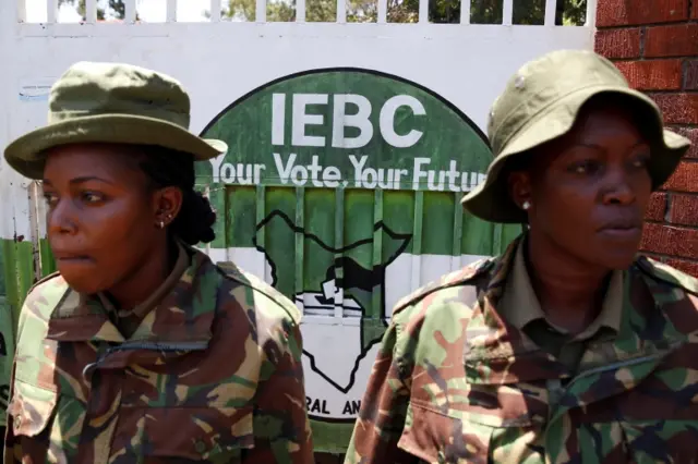 Policewomen stand guard outside the Independent Electoral and Boundaries Commission (IEBC) headquarters during a protest by supporters of Kenyan opposition leader Raila Odinga in Kisumu, Kenya, October 25, 2017