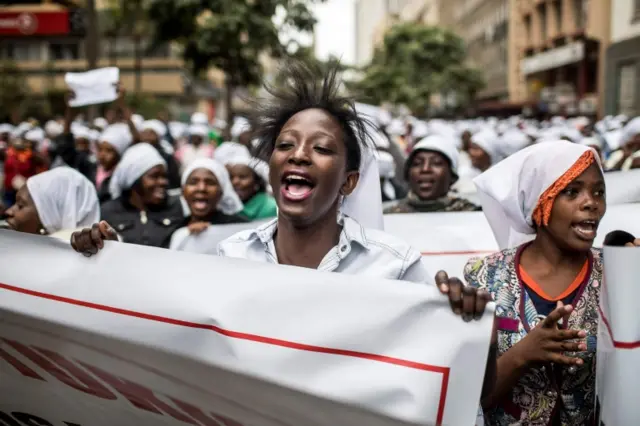 Kenyan women wearing white scarfs stage a multi-faith demonstration calling for peaceful election in downtown Nairobi on 25 October 2017