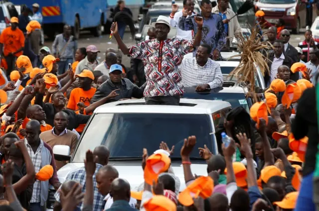 Kenyan opposition leader Raila Odinga, the presidential candidate of the National Super Alliance (NASA) coalition, greets his supporters during a rally at the Uhuru Park in Nairobi, Kenya October 25, 2017