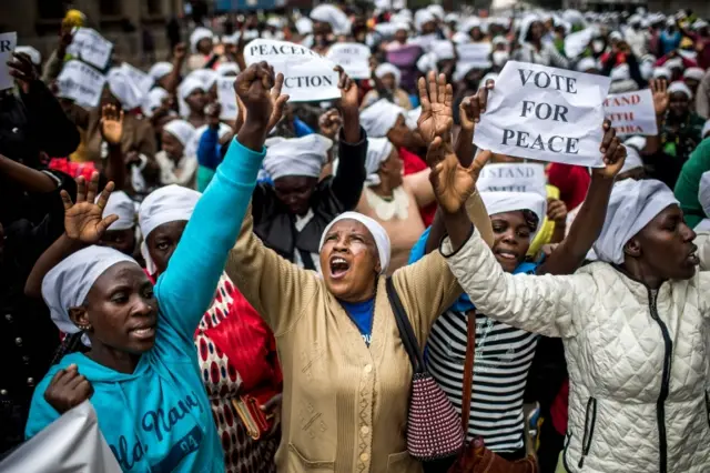 Kenyan women wearing white scarfs stage a multi-faith demonstration calling for a peaceful election in downtown Nairobi on October 25, 2017.