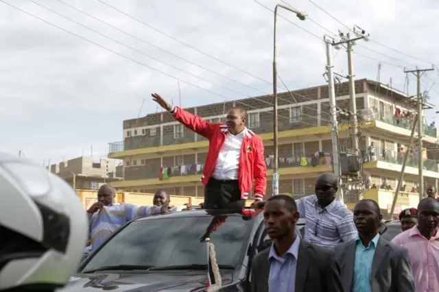 Kenyan President and the leader of the ruling Jubilee party Uhuru Kenyatta (C) waves at his supporters during his last campaign tour in Nairobi, Kenya, 23 October 2017.