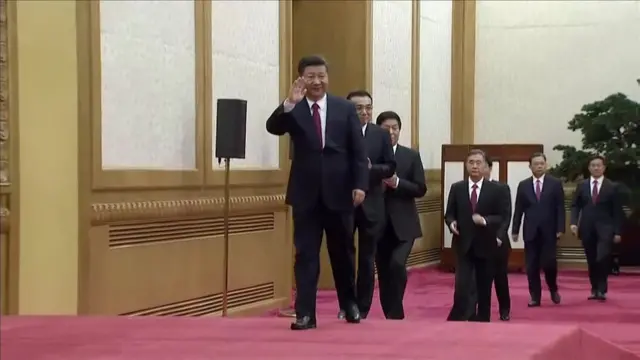 Xi Jinping and members of the standing committee take the stage